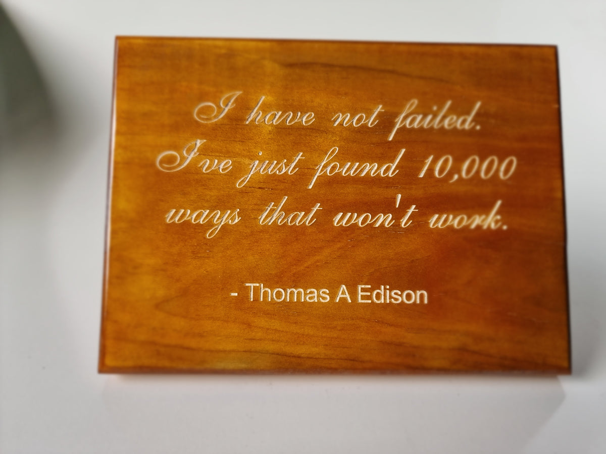 Small laser engraved timber desktop plaque with stand featuring Thomas Edison motivational quote