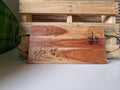 Custom laser engraved timber serving board with food and wine illustration featuring bread, grapes, cheese and wine glasses