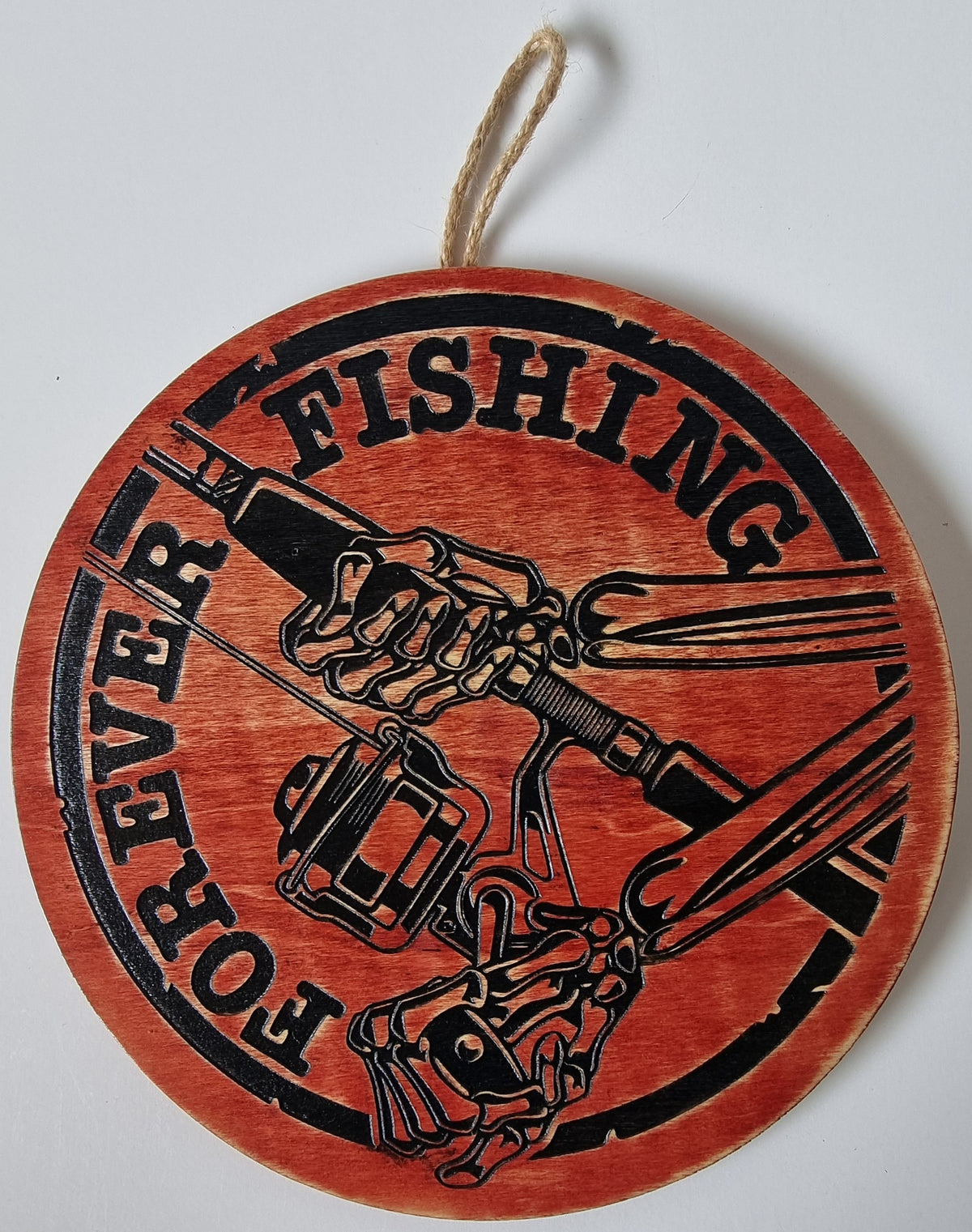 Forever Fishing laser engraved circular timber sign on 6mm plywood with jute hanging loop